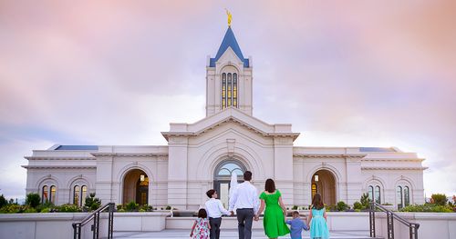 Family walks up steps toward Fort Collins Colorado Temple.