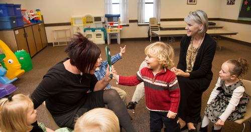 children playing with teachers