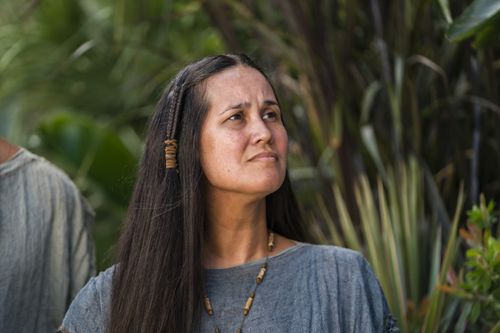 A woman listens as Alma the Younger preaches to the people of Gideon.