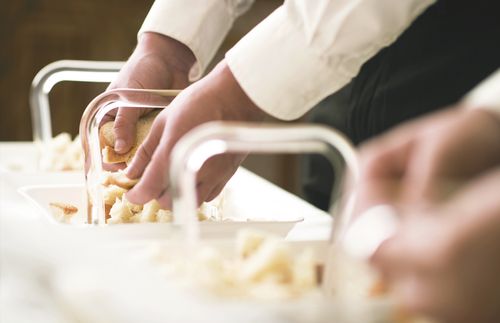 bread being broken for sacrament