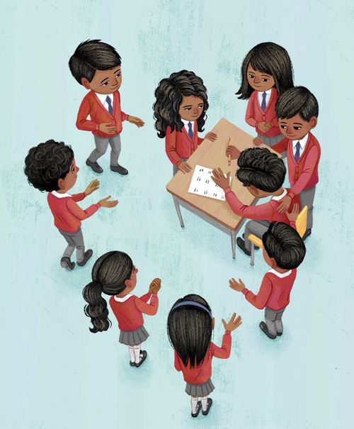Children surrounding a boy sitting in a school desk