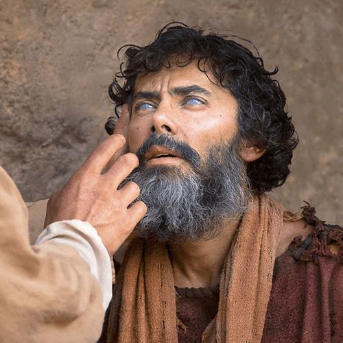 hombre ciego siendo sanado por Jesús