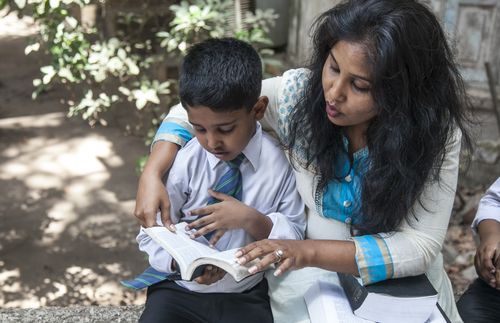 mother teaching son