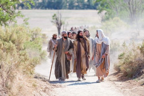 portrayal of Jesus and disciples walking on a road