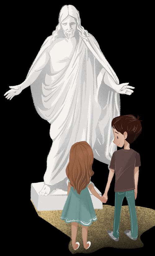 boy and girl looking at statue of Jesus