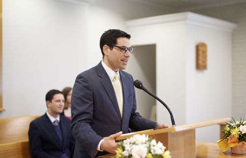 man speaking at the pulpit in church