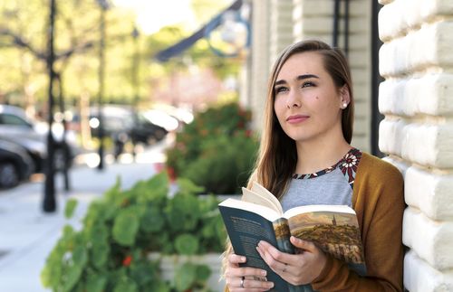 woman reading Saints book