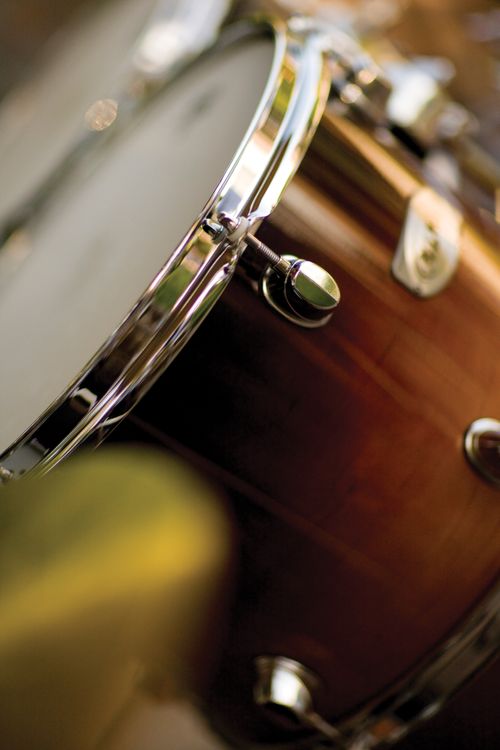 An image of brown drums used in a percussion group.