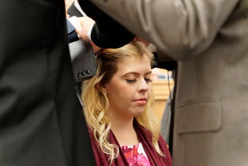 young woman being confirmed