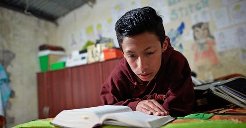 young man studying scriptures