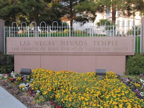 A stone sign on the grounds of the Las Vegas Nevada Temple engraved with the name of the temple and the Church.