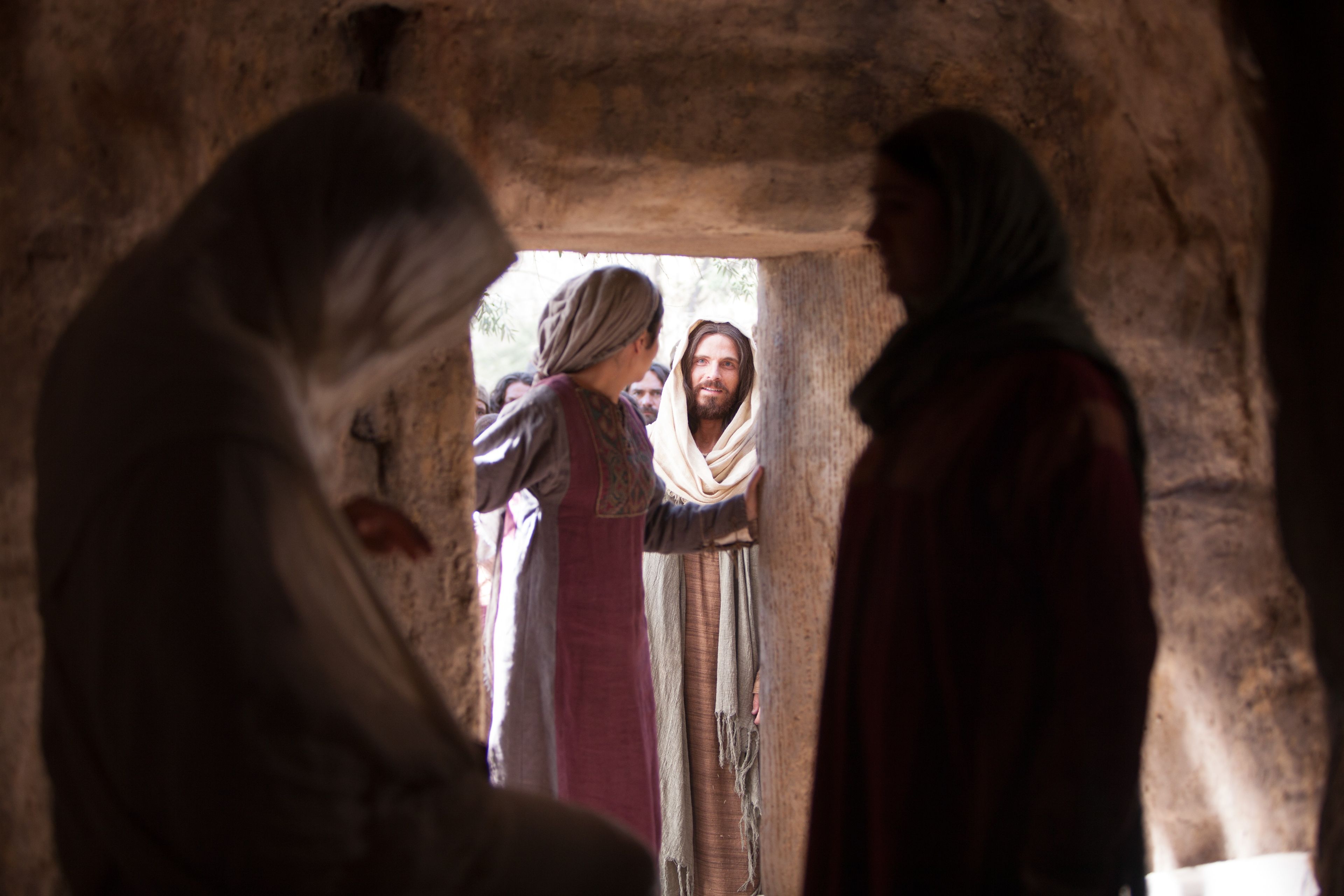 Lazarus walking out of his tomb after he has been raised from the dead by Jesus Christ.
