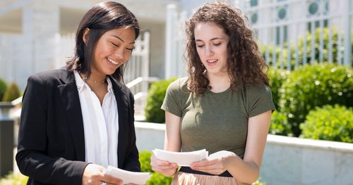 young women outside temple