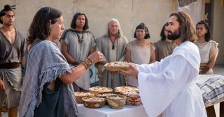 Jesus administers the sacrament to the Nephites