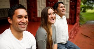 young adult siblings enjoy time with their father