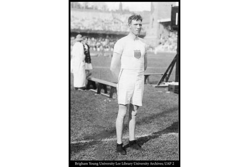 Alma Richards standing in a stadium