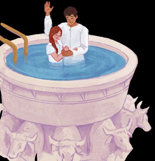 A girl being baptized in a temple baptismal font