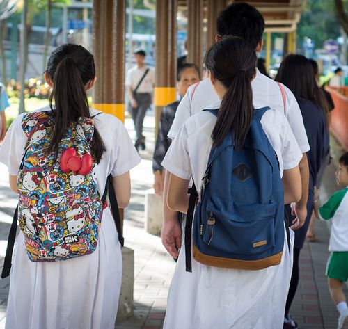 two female students with backpacks