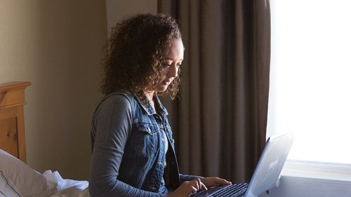 a young woman on her laptop