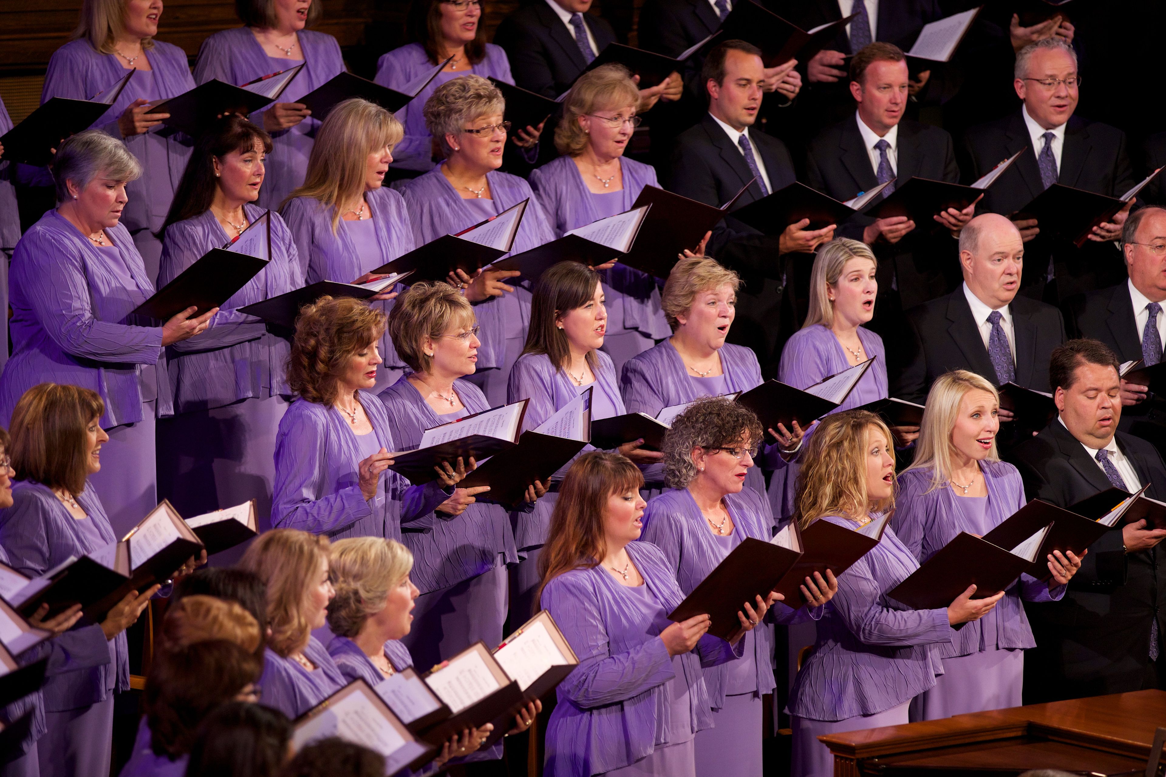 A view of the women of the Mormon Tabernacle Choir in purple dresses at the funeral of President Boyd K. Packer in July 2015.