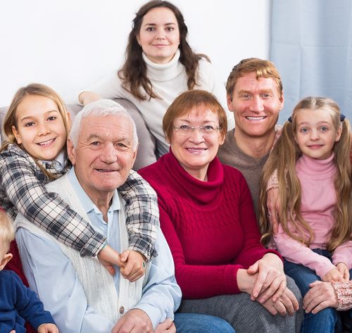 multi-generational family photo on couch