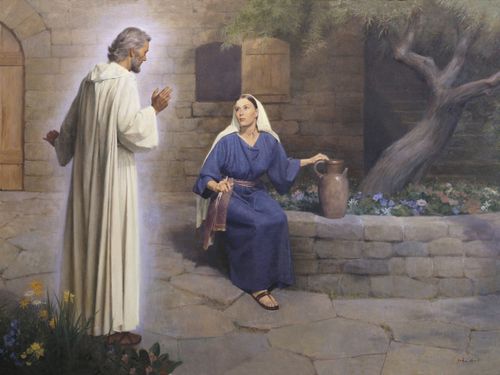 The angel Gabriel (Noah) appearing to Mary and declaring to her that she would become the mother of Jesus Christ. Mary is depicted seated on a round stone ledge. The ledge borders a tree and flowers. The angel Gabriel is depicted wearing white robes. A stone wall and stairways are in the background. There are flowers in the foreground. Luke 1:26-38