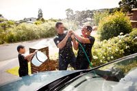 family washing car