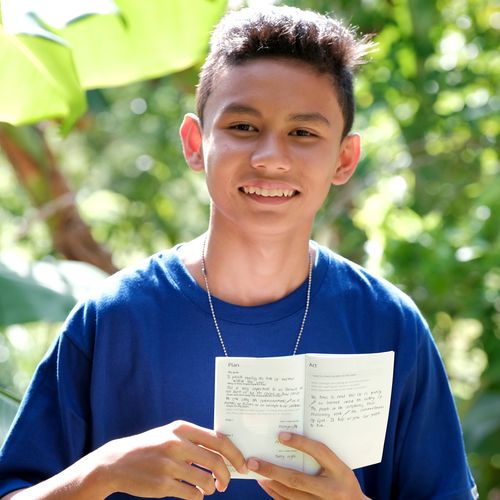 young man with booklet