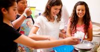 young women cooking