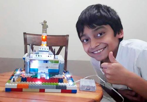 boy with block temple he built