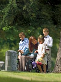 family at gravestone