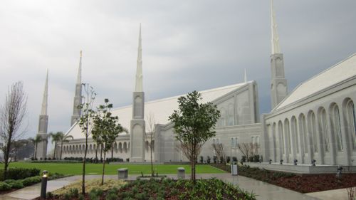 A side view of the Buenos Aires Argentina Temple, with small trees growing on the grounds.