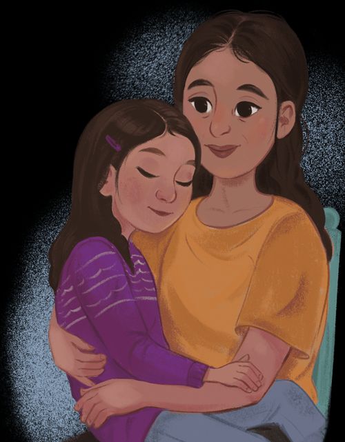 Girl sitting on mother’s lap