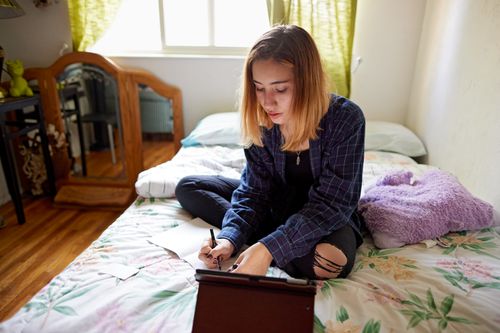 young woman writing