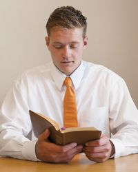 young man reading scriptures