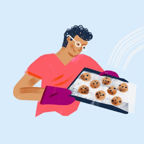 young man baking cookies