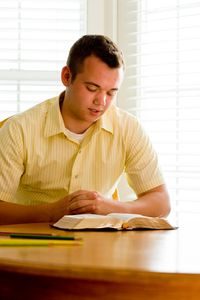 young man reading scriptures