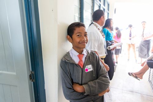 a smiling young man at a Church activity