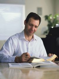 man studying scriptures