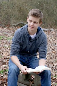 young man studying the scriptures