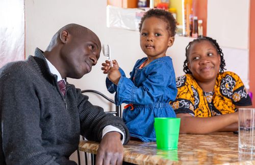 author with his wife and daughter