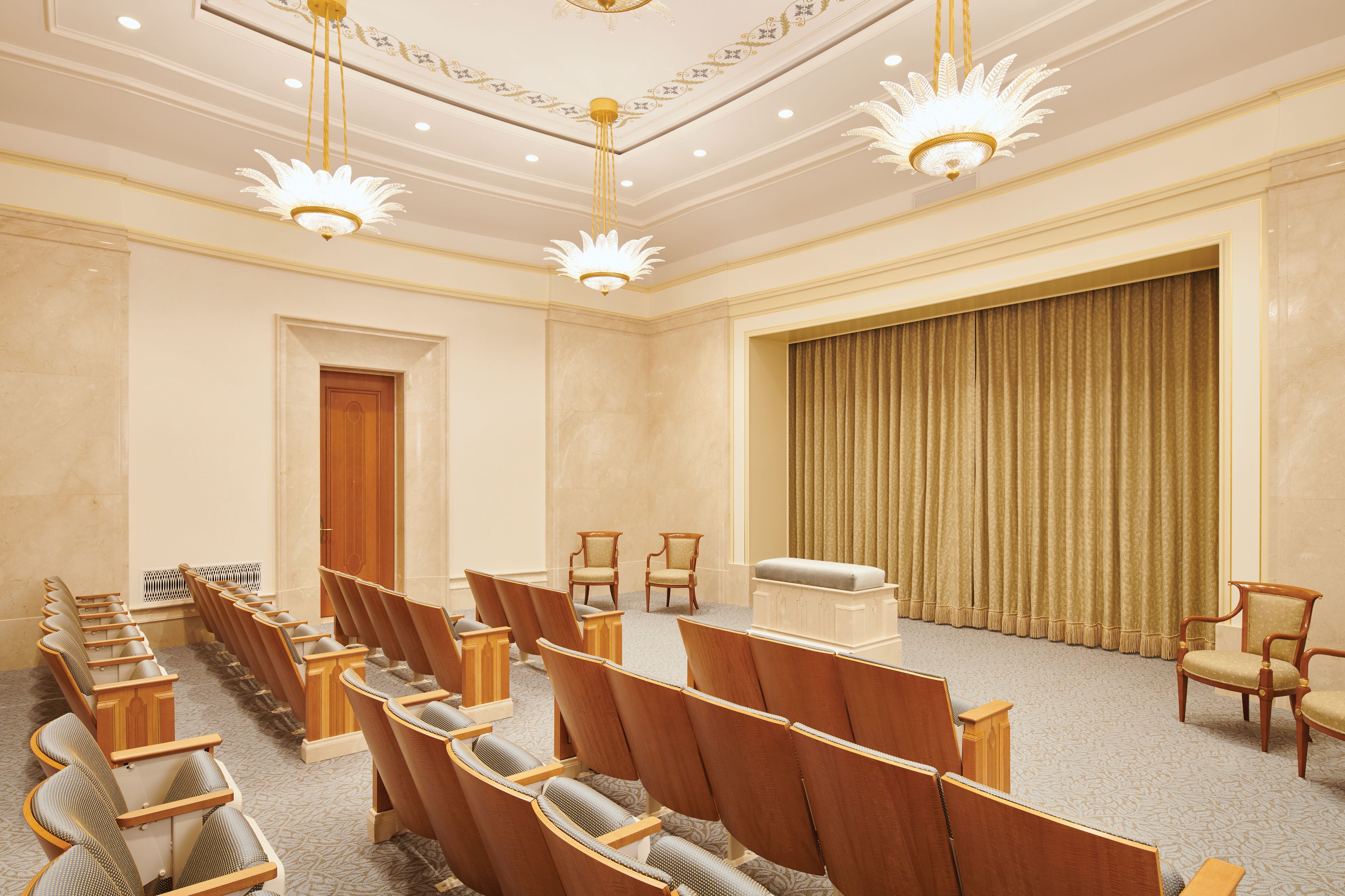 An instruction room in the Rome Italy Temple, with an altar where patrons make promises to God.
