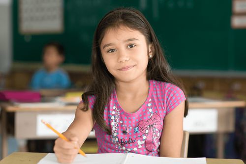 girl sitting at school desk