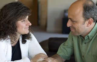 man and woman smiling at each other