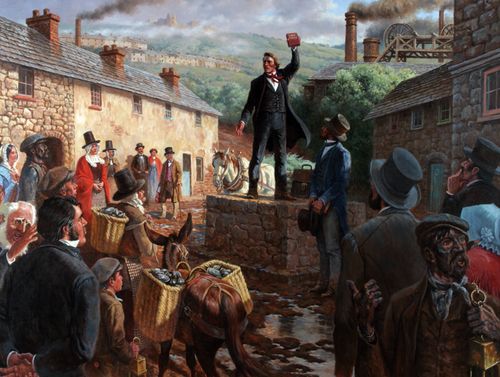 Dan Jones is depicted preaching the gospel in Wales.  He is standing on a stone wall talking to the people around him.  He has one arm upraised holding a copy of the Book of Mormon.