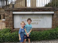 two boys standing outside temple