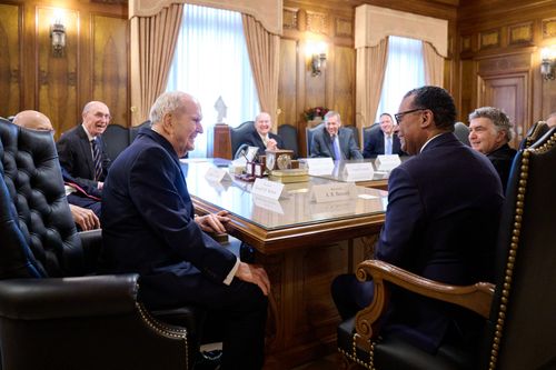 Church leaders visiting with religious leaders from New York