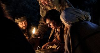 Nephi and his family studying the plates