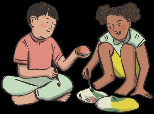 boy and girl painting rocks together