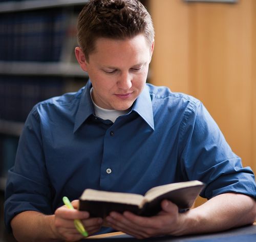 man reading book